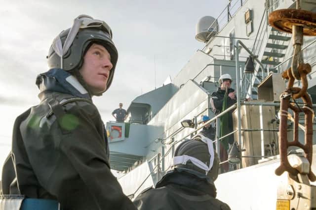 Approaching as the first light of day began to illuminate the sea, Sub Lieutenant Robbie Neilson and Leading Chef Nathan 'Pat' Garrett, Severn's senior boarding officer and his assistant, climbed up the swinging vertical ladder on to the vessel's deck to inspect the ship