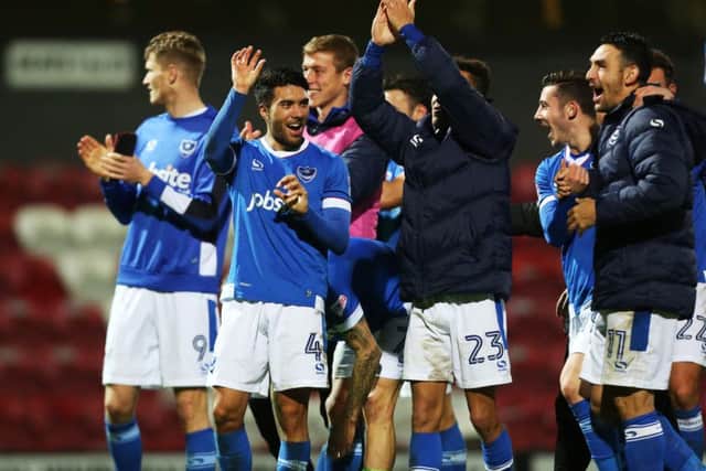 Pompey midfielder Danny Rose, centre left, is bidding to achieve successive League Two promotions   Picture: Joe Pepler