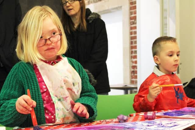 Families participating in one of Evolve's workshops at Aspex Gallery