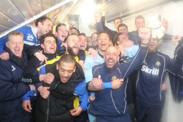 Mick Catlin joins the players in celebrating their FA Trophy semi-final success in 2014. Picture: Dave Haines