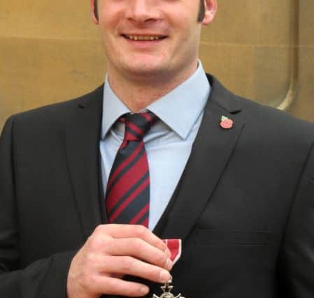Army veteran Dave Henson collecting his MBE
