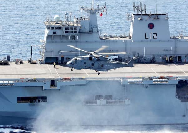 A Merlin helicopter leaving HMS Ocean