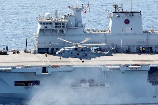 A Merlin helicopter leaving HMS Ocean