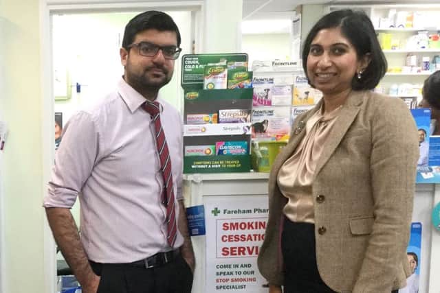 Suella Fernandes with Mujtaba Asharia, owner and pharmacist at Fareham Pharmacy