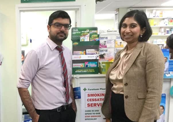 Suella Fernandes with Mujtaba Asharia, owner and pharmacist at Fareham Pharmacy