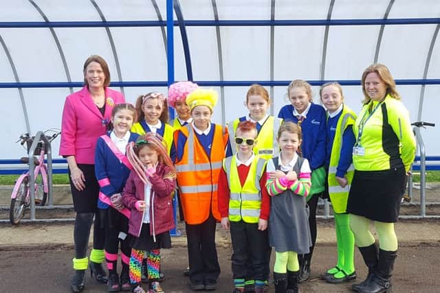 Far left,
Geogina Mulhall with Sarah Bottriell, right, with pupil from Gomer Infants and Juniors