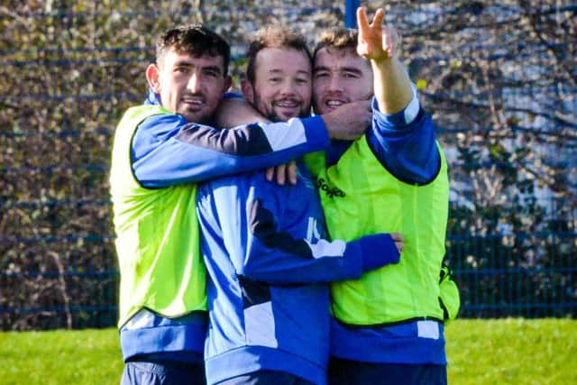 Pompey trio Gary Roberts, Noel Hunt and Adam Buxton are all smiles at the training ground  Picture: Colin Farmery