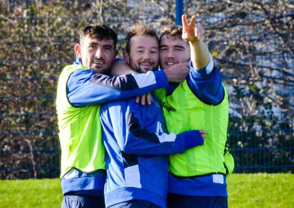 Pompey trio Gary Roberts, Noel Hunt and Adam Buxton are all smiles at the training ground  Picture: Colin Farmery