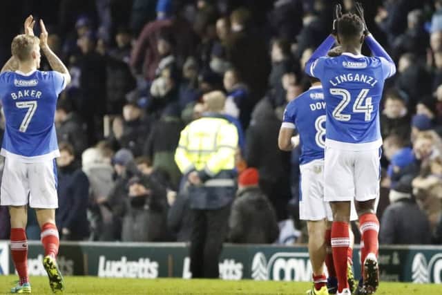 Carl Baker, Michael Doyle and Linganzi applause Pompey fans.Credit: Barry Zee PPP-170115-073240006