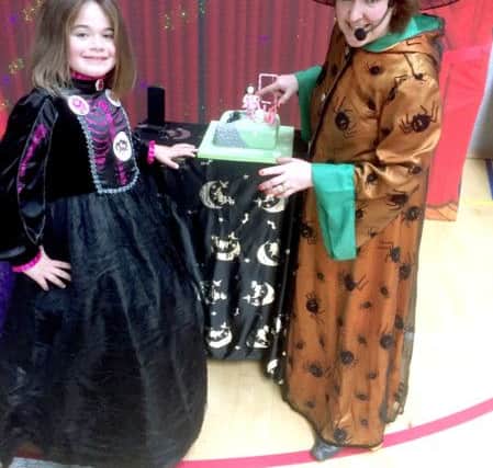 Birthday girl Maddison (left) was entertained by Izzy Wizzy Witch