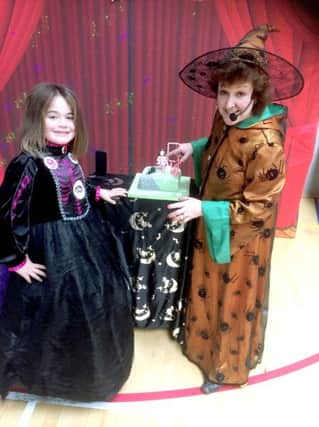 Birthday girl Maddison (left) was entertained by Izzy Wizzy Witch