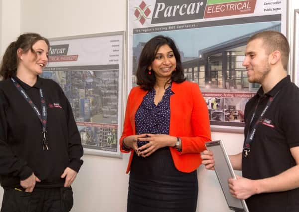 ParCar Engineering apprentices talk with MP Suella Fernandes.  Pictured with Suella are Sarah Alexander, a 1st year electrical apprentice, and Scott Stephens, who is qualifying after completing his electrical apprenticeship