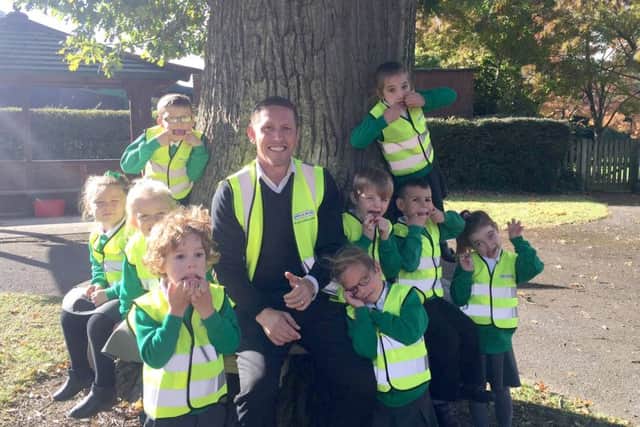 Mike Milburn with children from Springwood Infants School, at Waterlooville