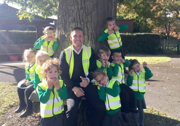 Mike Milburn with children from Springwood Infants School, at Waterlooville