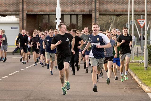 Runners compete along Royal Sovereign Avenue, HMS Collingwood