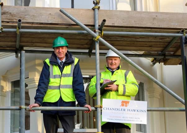 Peter Chandler, left, and Neil Hawkins of chartered surveyors Chandler Hawkins, on scaffolding outside their headquarters in Landport Terrace, Portsmouth