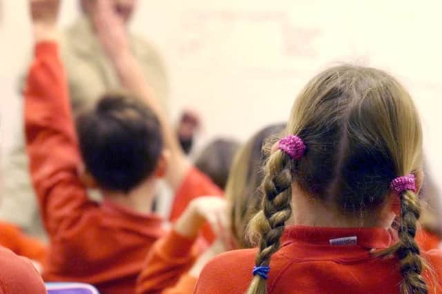 File photo dated 03/12/03 of pupils during a lesson as teachers would have to be licensed and could be sacked if they fail tough checks on their abilities, under plans unveiled by Labour. PRESS ASSOCIATION Photo. Issue date: Saturday January 11, 2014. See PA story EDUCATION Teachers. Photo credit should read: Barry Batchelor/PA Wire PPP-170901-130439001