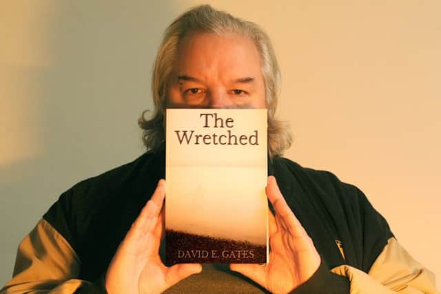 David E Gates with his new book, The Wretched, which was inspired by Portsmouth