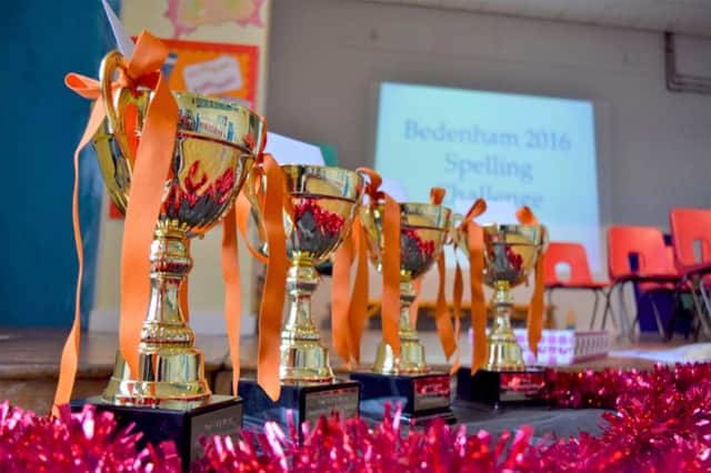 The trophies for the Bedenham Spelling Championship and, inset, the winners