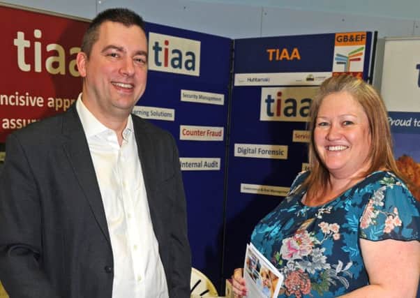 Last year's Gosport Business and Employment Fair - visitor Carl Garrod, who works in sales, talks to Louisa Bowers of business auditors TIAA Picture: Ian Hargreaves (160168-3)