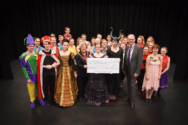 Performers from Fareham College donate a cheque to the Mayor of Fareham