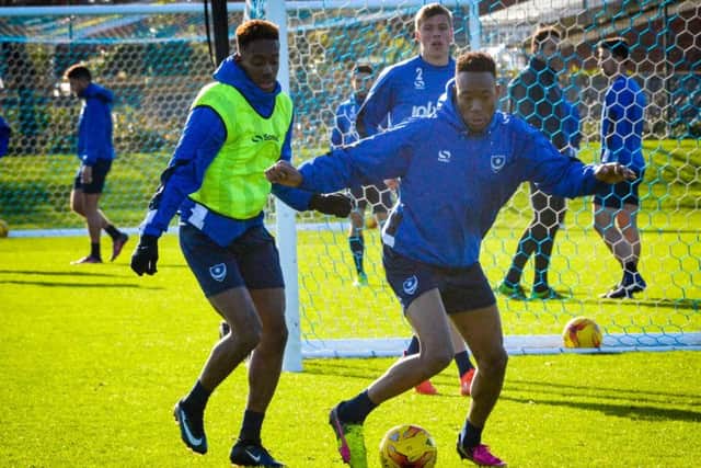Jamal Lowe, left, and Nicke Kabamba in action during Pompey training Picture: Colin Farmery