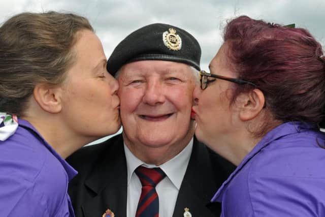 A free day of entertainment was held at Portsmouth Historic Dockyard for Armed Forces Day last year. Veteran Paul Hyde gets a smacker from Anna Mould, left, and Vie Portland from the Strolling Sirens
Picture: Ian Hargreaves (160844-3)