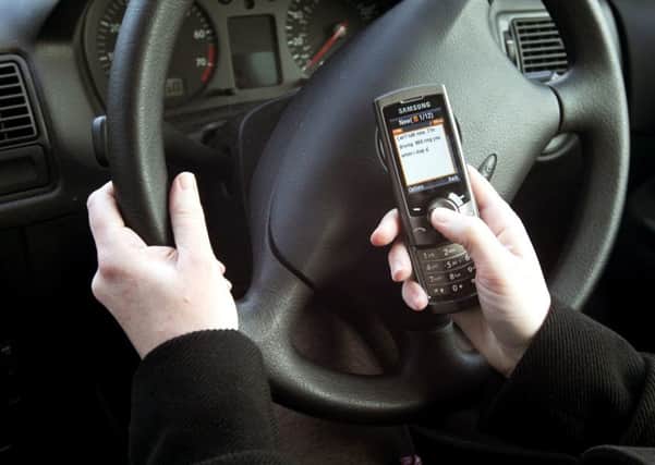 Police are launching a crackdown on mobile phone use at the wheel Picture posed by model