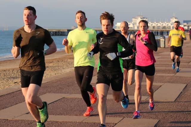 Southsea parkrun on Saturday. Left to right: Paddy Haynes, Shaun Newton, Chris Brobin, Nialls Davies and Jen Elkins get into their stride. Picture: David Brawn
