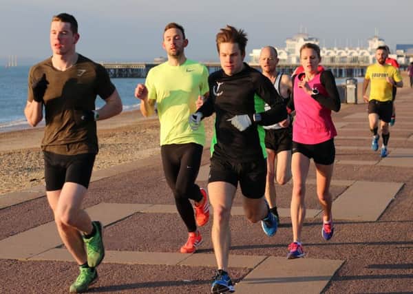 Southsea parkrun on Saturday. Left to right: Paddy Haynes, Shaun Newton, Chris Brobin, Nialls Davies and Jen Elkins get into their stride. Picture: David Brawn