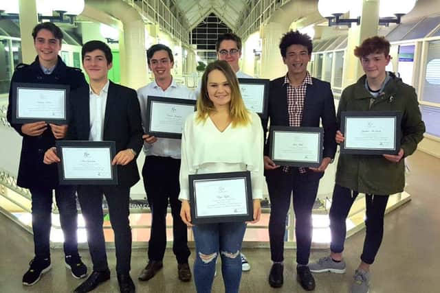 Students involved in the Fareham College social media video collect their certificates