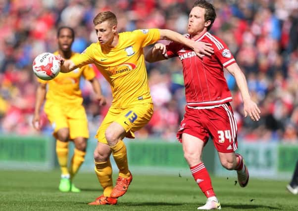 Pompey target Eoin Doyle, left, in action for Preston