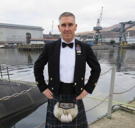 Warrant Officer Stephen Thomson modelling the first kilt to be made from the new Submarine Service tartan. Photo credit: Royal Navy/MoD/Crown copyright/PA Wire