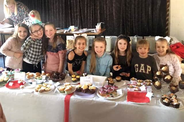 Lucy Fairall and friends at the bake-off competition for Cancer Research. Left, some tasty cakes