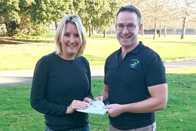 Gosport MP Caroline Dinenage donates two rail tickets to Steve Codling, from Charlies Beach Hut.