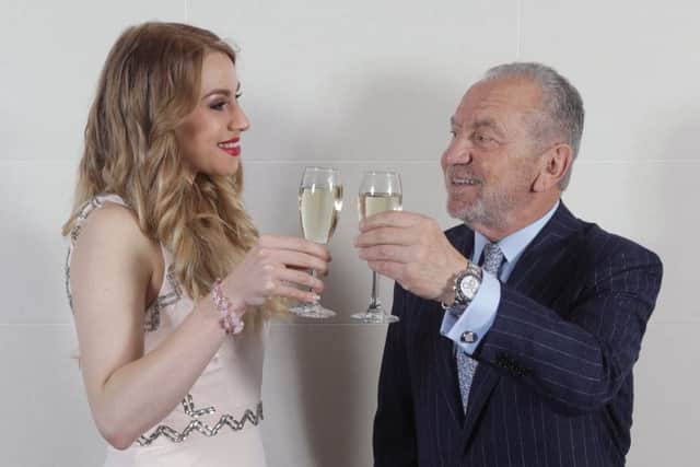 Lord Sugar and Alana Spencer celebrate her winning the 2016 series of The Apprentice,