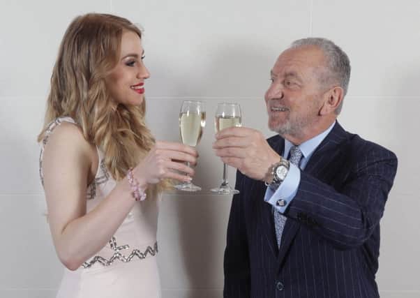 Lord Sugar and Alana Spencer celebrate her winning the 2016 series of The Apprentice,