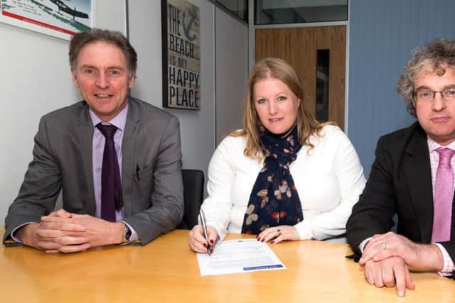Southampton City Council leader Simon Letts, Portsmouth's leader Donna Jones and Councillor Jonathan Bacon, the former leader of Isle of Wight Council signing the application for the Solent Combined Authority last year