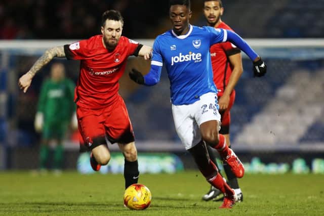 Pompey midfielder Amine Linganzi, right  Picture: Joe Pepler