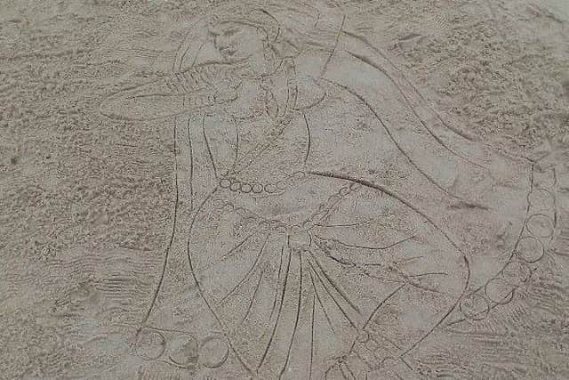 Sydney Kerens spotted a mystery artist drawing this image in the sand in Portsmouth