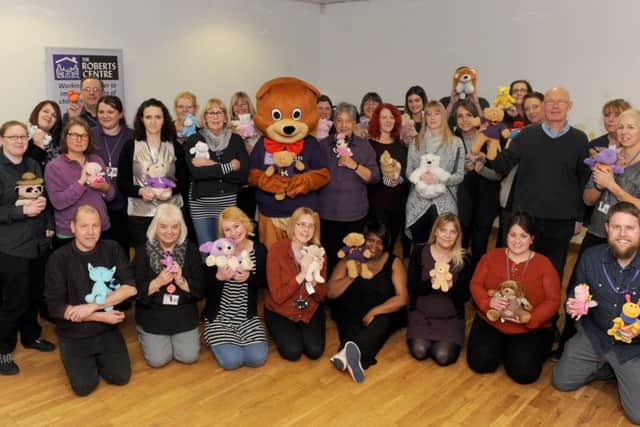 Staff from The Roberts Centre joined together at Landport Community Centre to mark the launch of the Find Robert The Bear Competition. Picture: Sarah Standing (170129-1543)