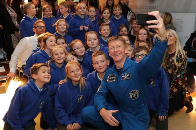 British astronaut Tim Peake takes a selfie with students from his former school, Westbourne Primary, after a Q&A at the Novium Museum in Chichester Picture: Andrew Matthews/PA Wire