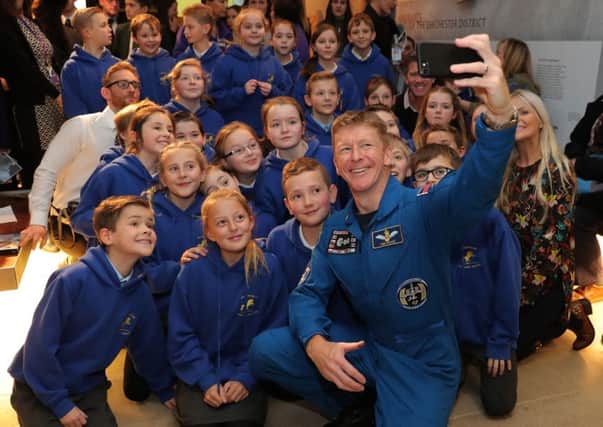 British astronaut Tim Peake takes a selfie with students from his former school, Westbourne Primary, after a Q&A at the Novium Museum in Chichester Picture: Andrew Matthews/PA Wire
