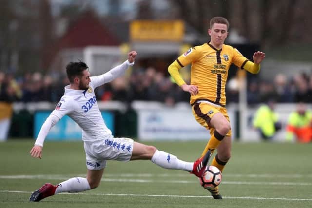 Adam May, right, helped Sutton beat Leeds in round four