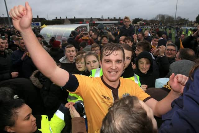 Jamie Collins scored the winning goal from the penalty spot as Sutton United stunned Leeds United to earn a fifth-round FA Cup tie with Arsenal