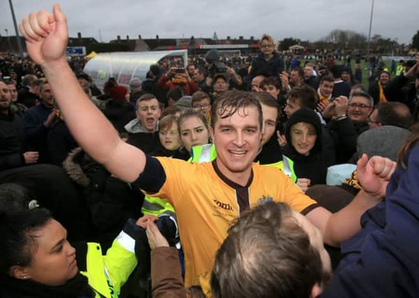 Jamie Collins scored the winning goal from the penalty spot as Sutton United stunned Leeds United to earn a fifth-round FA Cup tie with Arsenal