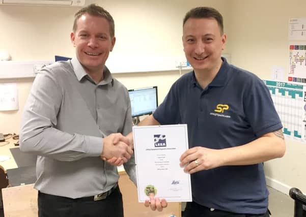 Alfie Lee, operations director at Straightpoint, left, with Straightpoint product technician Gavin Arnell, who passed the Lifting Equipment Engineers Association (LEEA) P1E Foundation Course