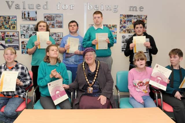 31/1/2017 (TS)
Rachel Madocks Special School in Waterlooville, held an achievement assembly for their Key Stage 4 pupils who have gained their ASDAN certificate.
Pictured is: (front middle) The Mayor of Havant Faith Ponsonby with some of the children who were awarded (back l-r) Ben Hoskin (16), Jack Symmans (16), Ashley Lawson (16), Toby Jackson (17) and (front l-r) Lucy Hopgood (16), Arianne Blackley (14), Lauren Greene (15) and Billy Predeth (17).
Picture: Sarah Standing (170137-1915)