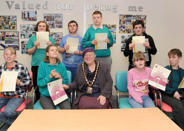 31/1/2017 (TS)

Rachel Madocks Special School in Waterlooville, held an achievement assembly for their Key Stage 4 pupils who have gained their ASDAN certificate.

Pictured is: (front middle) The Mayor of Havant Faith Ponsonby with some of the children who were awarded (back l-r) Ben Hoskin (16), Jack Symmans (16), Ashley Lawson (16), Toby Jackson (17) and (front l-r) Lucy Hopgood (16), Arianne Blackley (14), Lauren Greene (15) and Billy Predeth (17).

Picture: Sarah Standing (170137-1915)