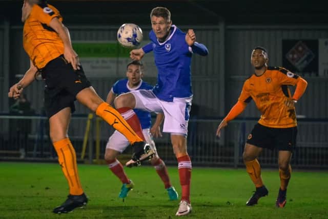 Aaron Simpson, right, in action against Pompey Reserves this season. Picture: Colin Farmery